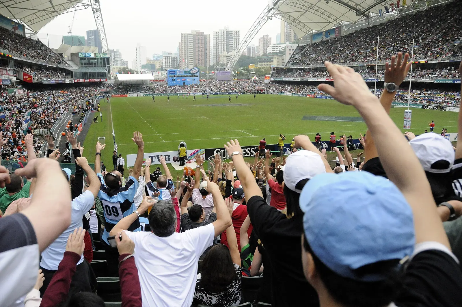 Spectators cheering in the stands at the Hong Kong Sevens in 2009
